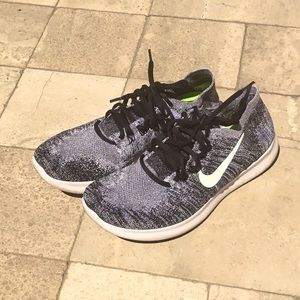 Nike free flyknit running shoe.Black/white. Sz 7.5